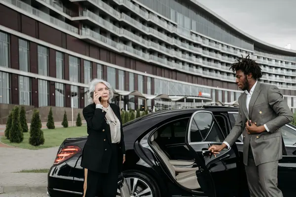 Chauffeur waiting to welcome client at London airport